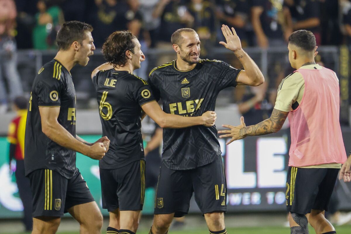 LAFC defender Giorgio Chiellini (14) celebrates with midfielder Ilie Sanchez (6) after defeating the Galaxy.