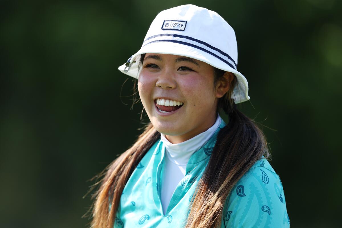 Jasmine Koo relaxes between shots during a recent round of golf.