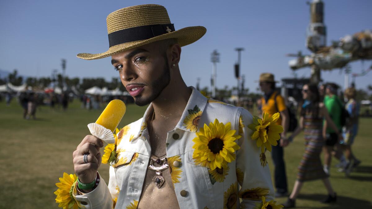 Jose Lepucio, 23, of Des Moines keeps cool with an icy treat.