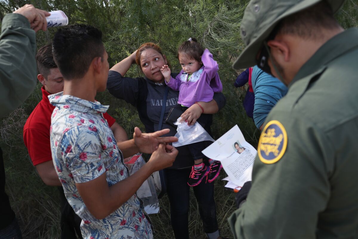 U.S. Border Patrol agents apprehend group of Central American asylum seekers in Texas