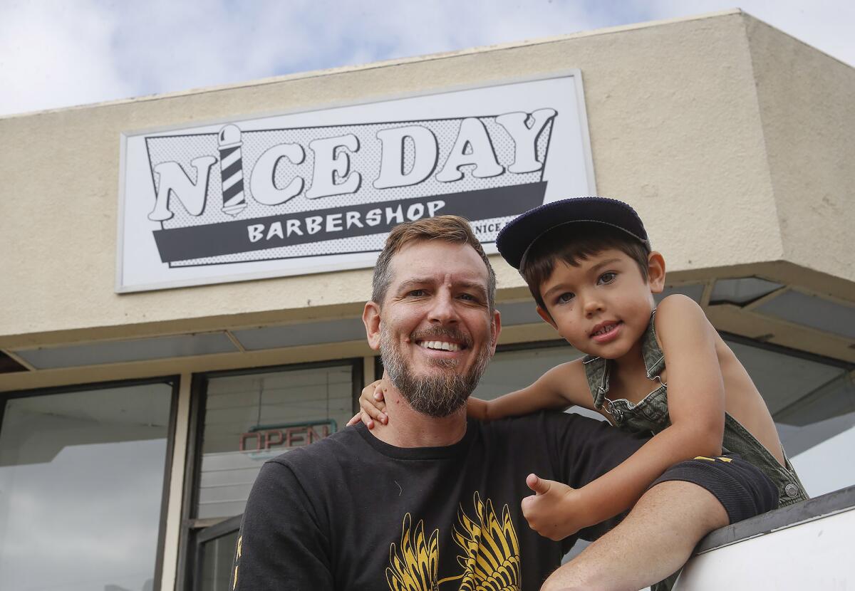 Jake Bushnell, pictured with his son Rocky, was the lead singer of the band HB Surround Sound.