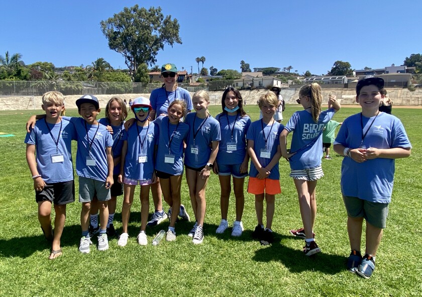 La Jolla High School junior Kate Peay stands with fifth-grade members of the Bird Rock Elementary School "Bird Squad."