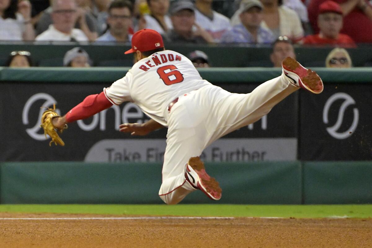 Anthony Rendon reaches for a double by Toronto's Vladimir Guerrero Jr. in the fifth inning.