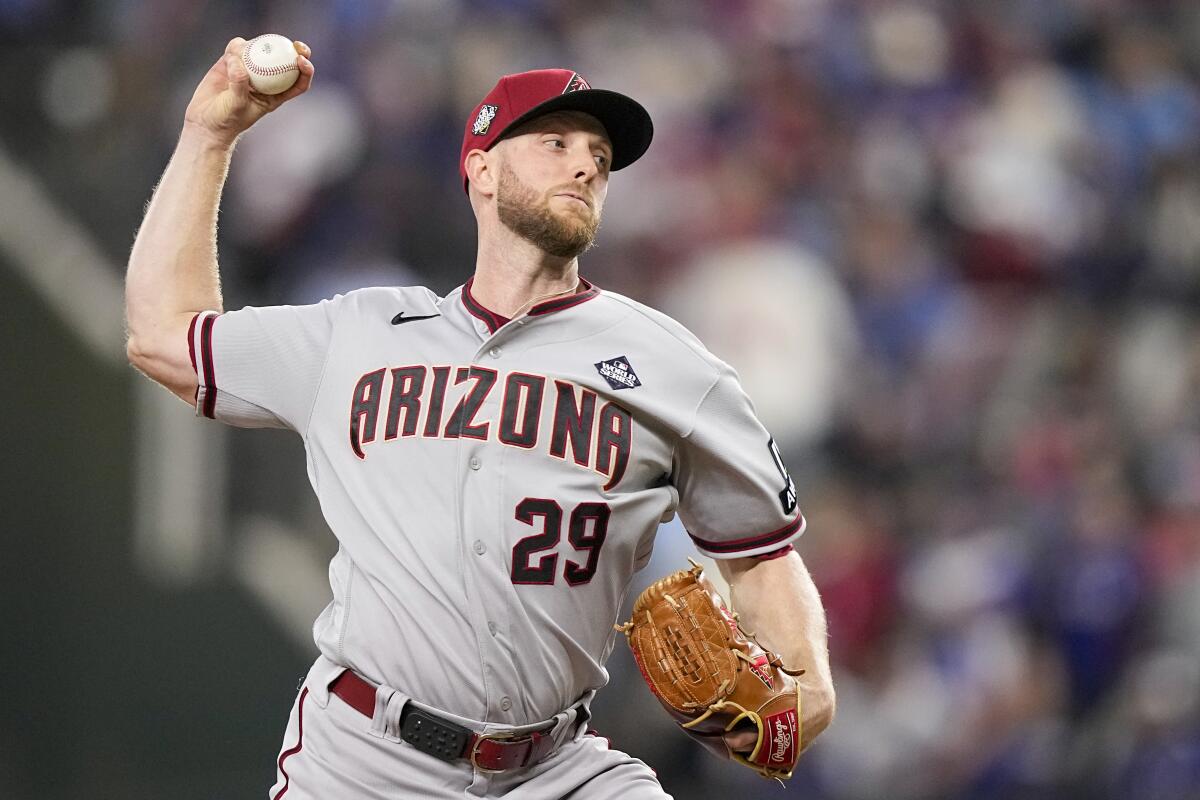 Arizona Diamondbacks starting pitcher Merrill Kelly delivers against Texas Rangers in Game 2 of the World Series.