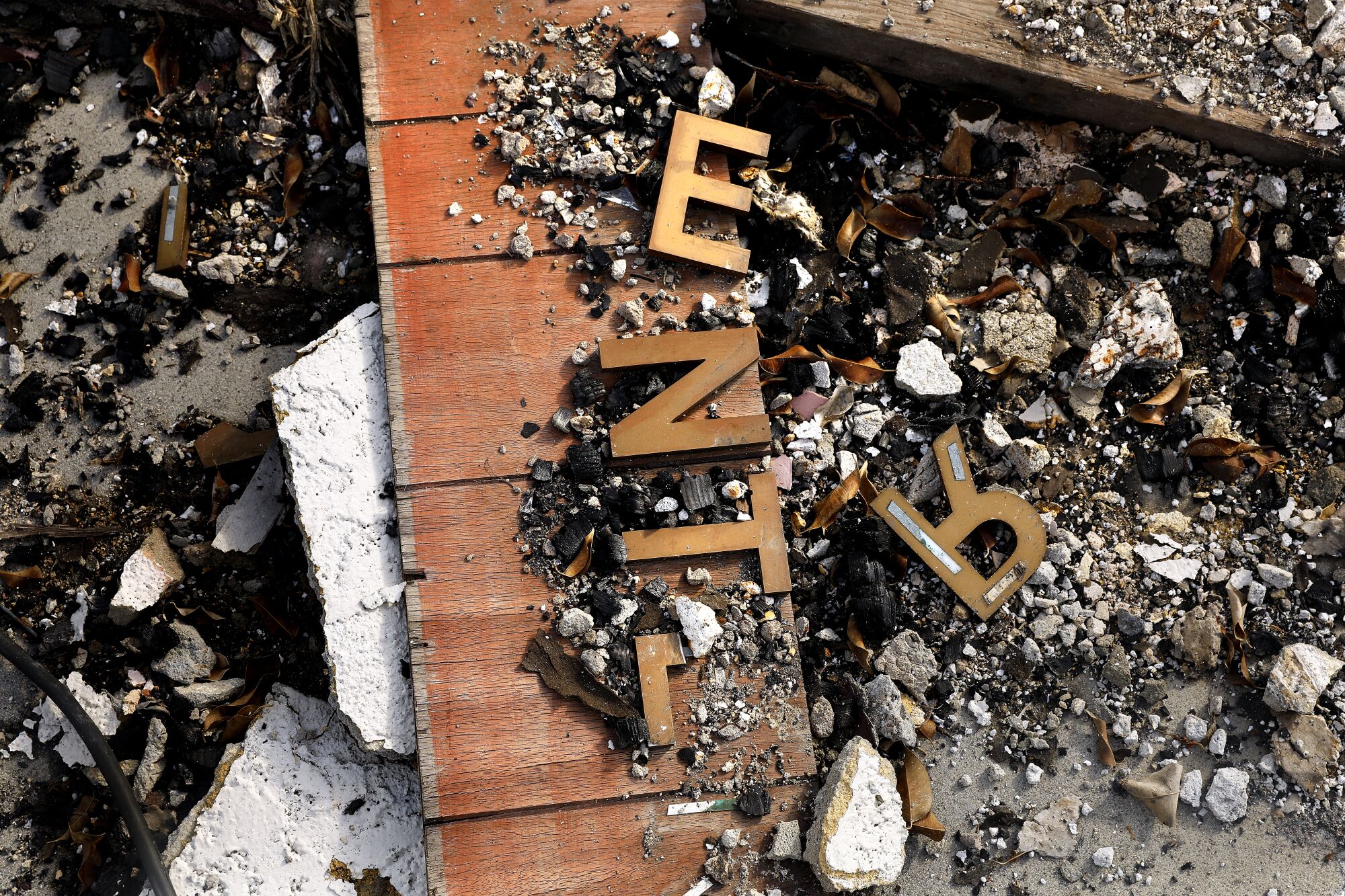 A burned "Enter" sign at Victory Baptist Church in South Los Angeles