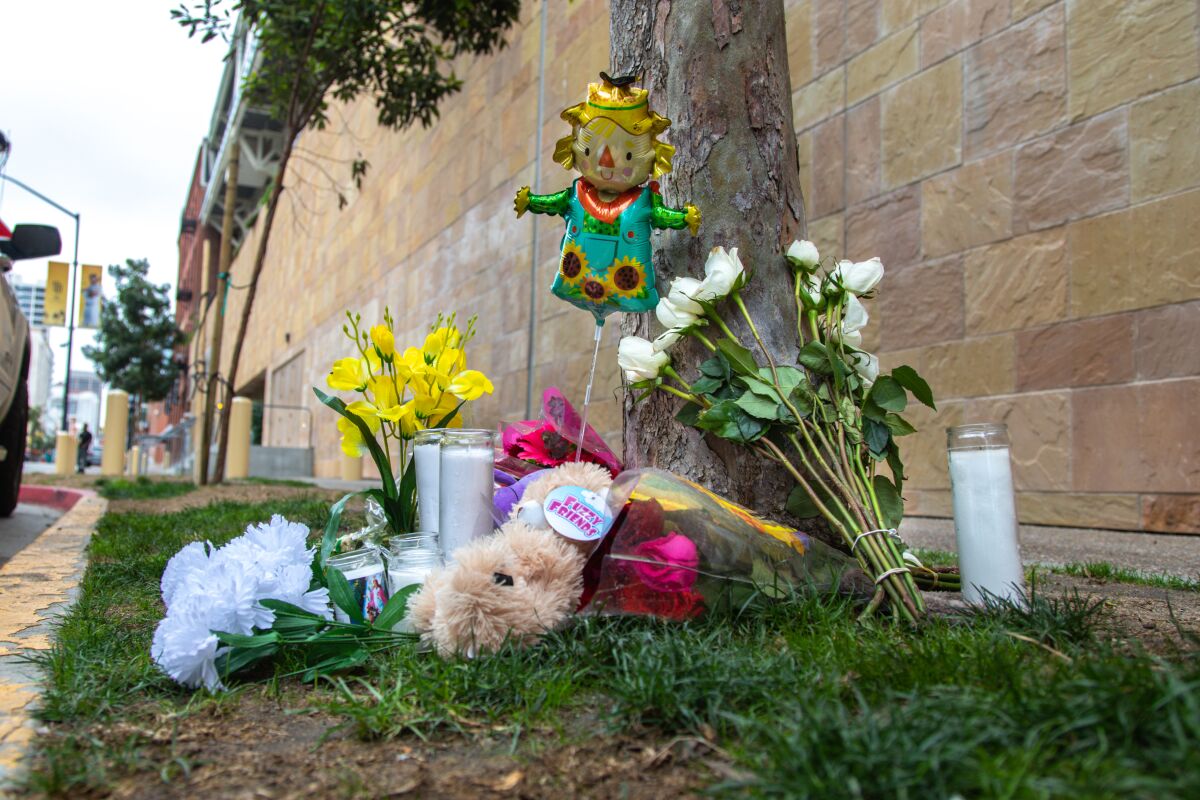 A memorial outside Petco Park on Monday, Sept. 27, 2021 for a woman and child who died there on Saturday.