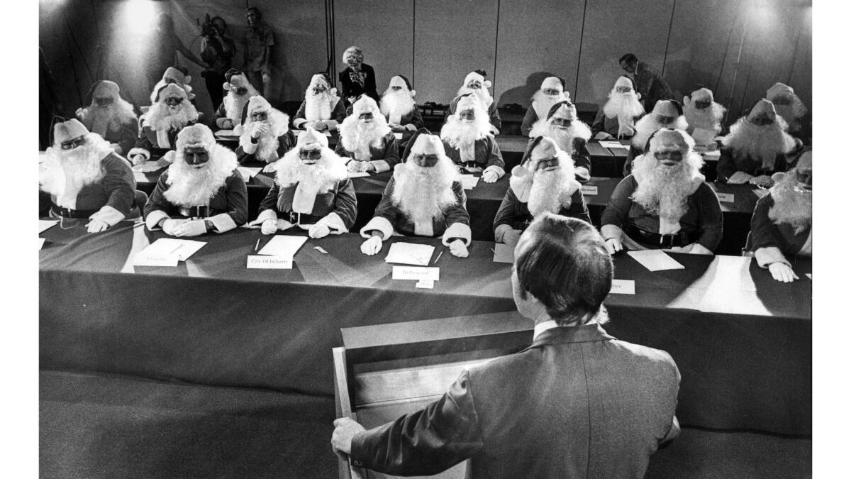Nov 24, 1976: Twenty-eight members of the Sears Roebuck Santa Claus school get some final tips before they begin a four-week stints as St. Nick.