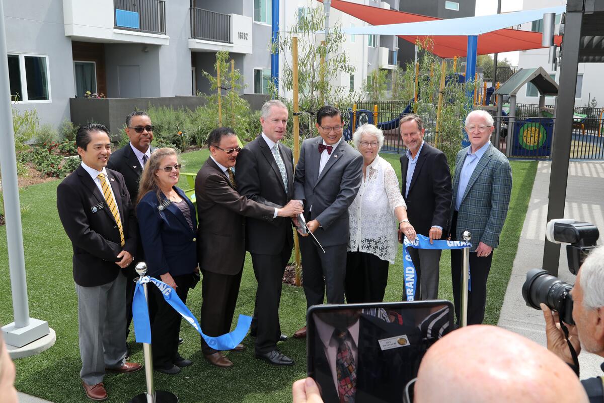 Officials attend a ribbon-cutting ceremony for Prado, an affordable housing community, on Wednesday in Fountain Valley.