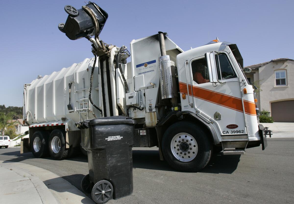  A San Diego city trash truck picks up garbage in the Scripps Ranch area.  