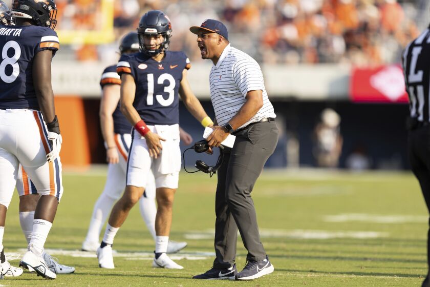 Virginia's head coach Tony Elliott yells during an NCAA college football game against Old Dominion in Charlottesville, Va on Saturday, Sept. 17, 2022. (Mike Kropf/The Daily Progress via AP)