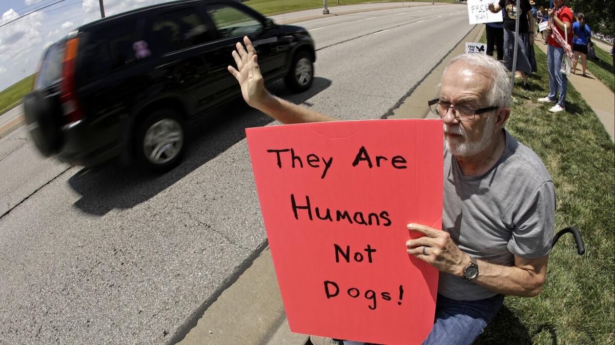 A protester in Kansas reacting to the government's immigration detention policies.