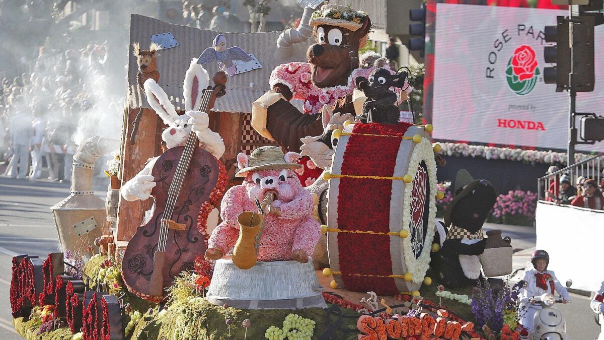 The Burbank float built by the Burbank Tournament of Roses Assn. titled "Stompin' Good Time," and winner of the Animation Award, passes in front of the grand stands at the 2019 Rose Parade in Pasadena on Tuesday.
