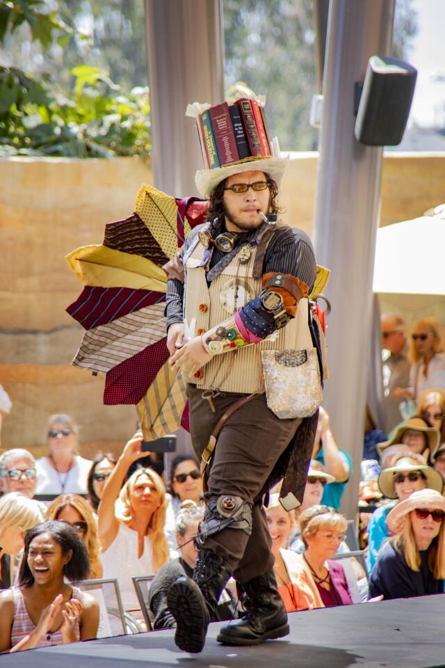 Logan Campos models designer Rachelle Weir's eclectic outfit evoking H.G. Wells' science-fiction novel "The Time Machine." The outfit won the award for Most Innovative Use of Materials at Sunday's Festival of Arts fashion show in Laguna Beach.