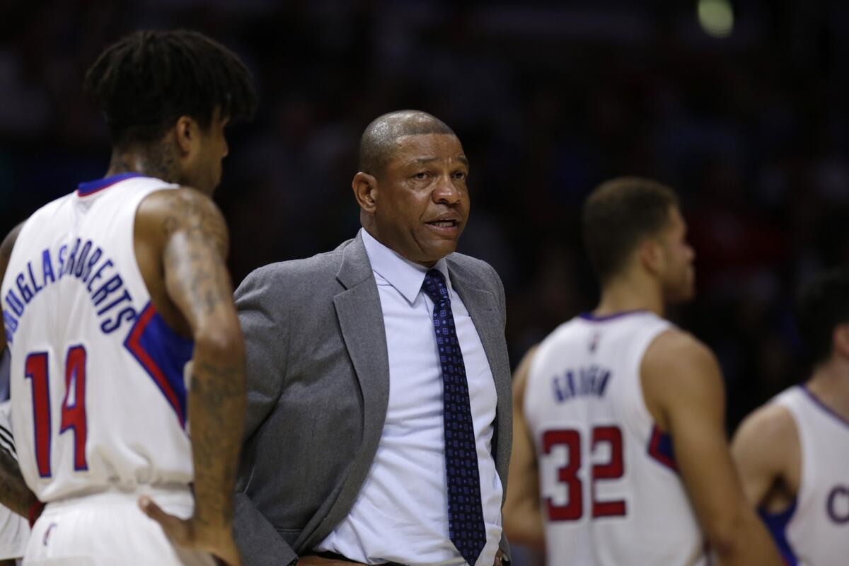 Clippers Coach Doc Rivers stands during a timeout in an exhibition game against the Phoenix Suns on Oct. 22.