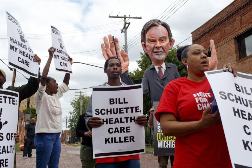 Members of the Service Employees International Union (SEIU) chant and protest outside before a campaign event for Michigan Attorney General Bill Schuette held at the Detroit Police Officers Association offices in Detroit, Mich. on Oct. 4, 2018. Bill Schuette is running for governor of Michigan against democratic candidate Gretchen Whitmer.