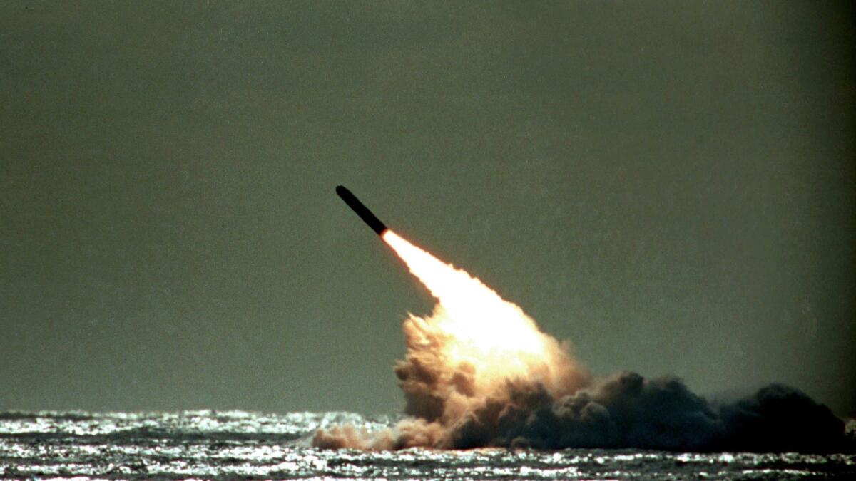 A Trident II missile is launched by the U.S. Navy during a performance evaluation from the submerged submarine USS Tennessee in the Atlantic Ocean.
