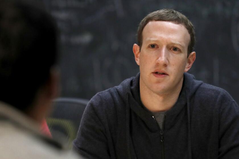 FILE- In this Nov. 9, 2017, file photo, Facebook CEO Mark Zuckerberg meets with a group of entrepreneurs and innovators during a round-table discussion at Cortex Innovation Community technology hub in St. Louis. With Zuckerberg, âits experiment, learn, experiment, learn,â said LinkedIn co-founder Reid Hoffman, who has known him since 2004. Hoffman said that is evident in Zuckerberg's enthusiasm for software, which can be overwritten to fix problems. (AP Photo/Jeff Roberson, File)