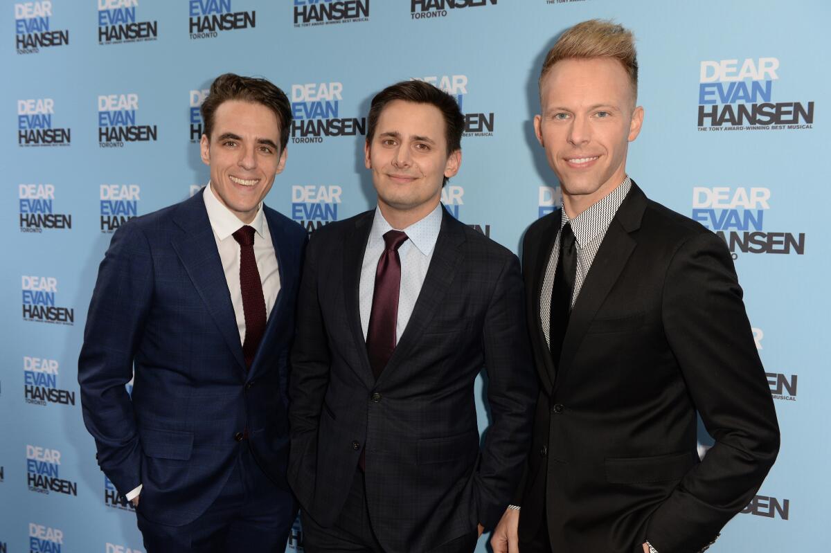 Three men pose at the opening of "Dear Evan Hansen."