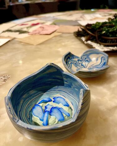 Clam emulsion topped with blue-tinged squid in the Black Rocks course at Virgilio Martinez' Central in Lima, Peru.