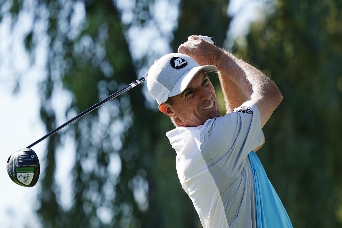 Steven Alker, of New Zealand, hits his tee shot at the fourth hole during the third round of the Charles Schwab Cup Championship golf tournament Nov. 13, 2021, in Phoenix. Alker has made nearly as much money in nine months of the PGA Tour Champions as the previous 20 years on six tours. (AP Photo/Ross D. Franklin)