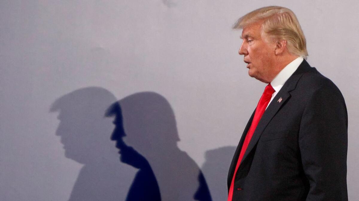 U.S. President Donald Trump casts shadows on the wall in Warsaw, Poland on July 6.