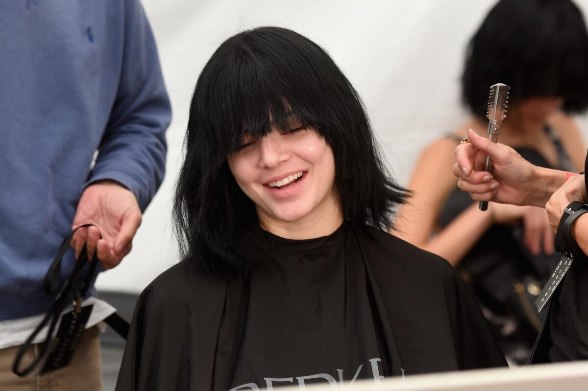Model Kendall (formerly Kendall Jenner) prepares backstage at the Marc Jacobs show.