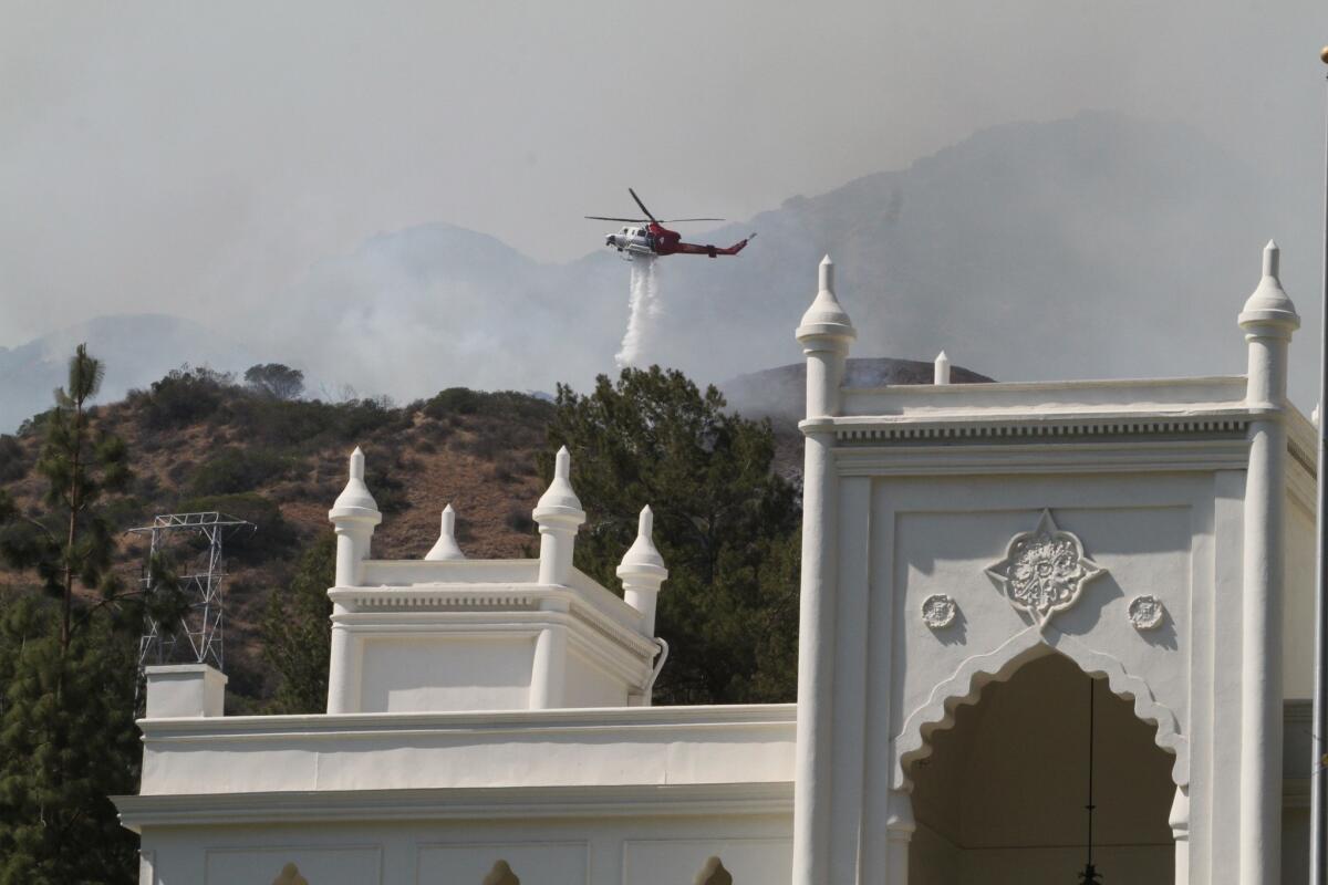 A brush fire burning north of Brand Park in Glendale is about 30% contained, city officials reported on Monday. The fire, photographed on Sunday, June 22, 2014, broke out before 1 p.m. just north of Brand Boulevard in the Verdugo Mountains.