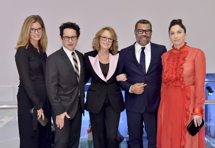 Katie McGrath, from left, J.J. Abrams, Hammer Museum Director Ann Philbin, honoree Jordan Peele and Chelsea Peretti at the Hammer's 17th Gala in the Garden in Los Angeles on Saturday.