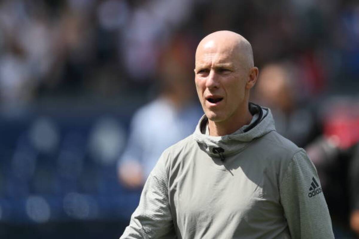 LAFC manager Bob Bradley walks onto the field 