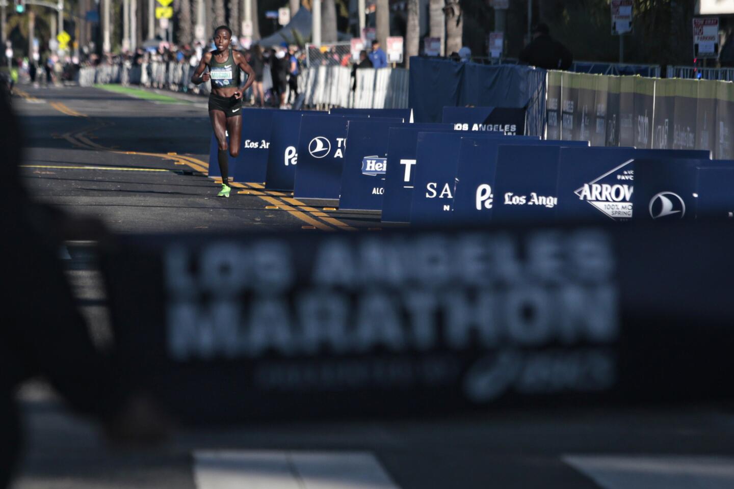 Margaret Muriuki, 33, of Kenya completes the 2020 Los Angeles Marathon on Sunday in Santa Monica.