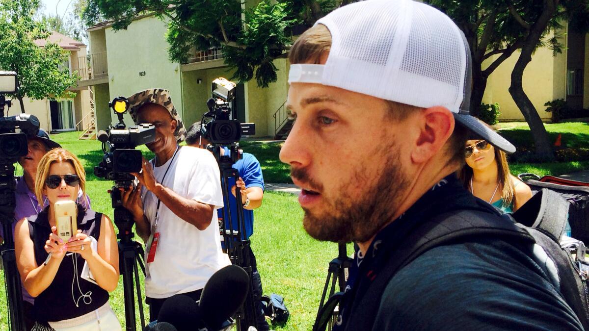 Rams quarterback Case Keenum addresses the media after arriving at camp on Thursday.