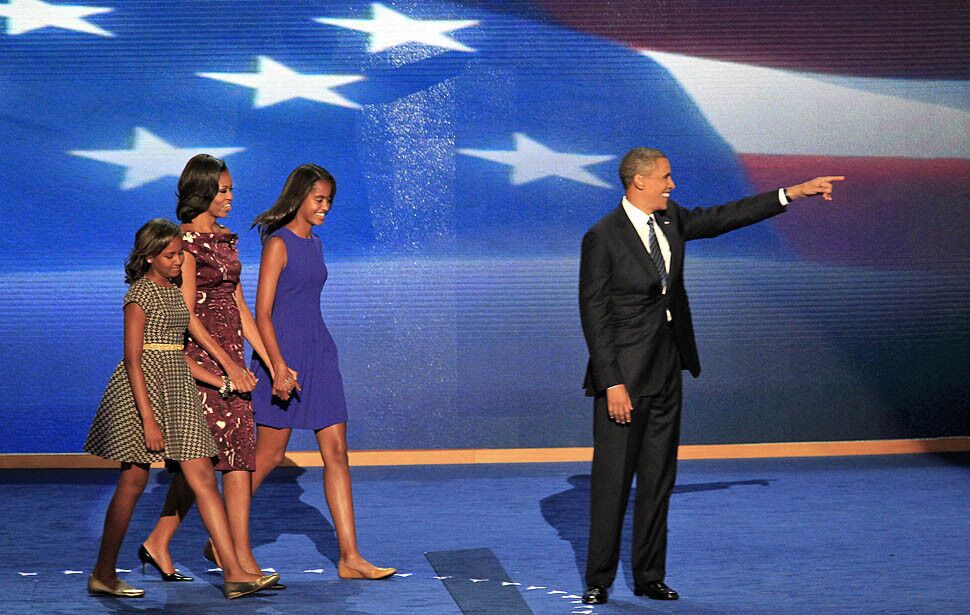 President Obama's family arrives on stage after he spoke at the Democratic National Convention.