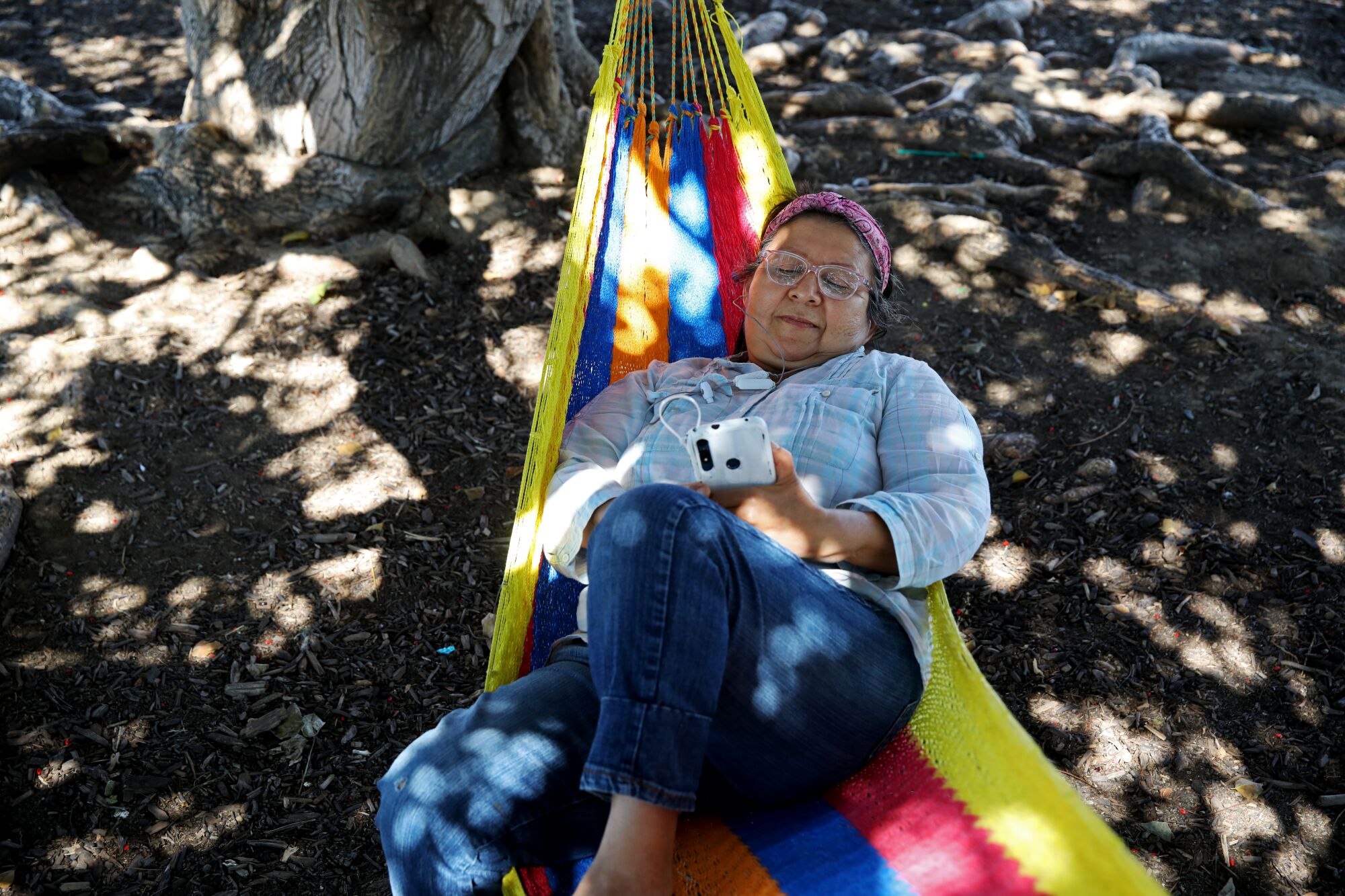 Blanca Bonoso hung a hammock to cool off at Magic Johnson Park in Willowbrook 