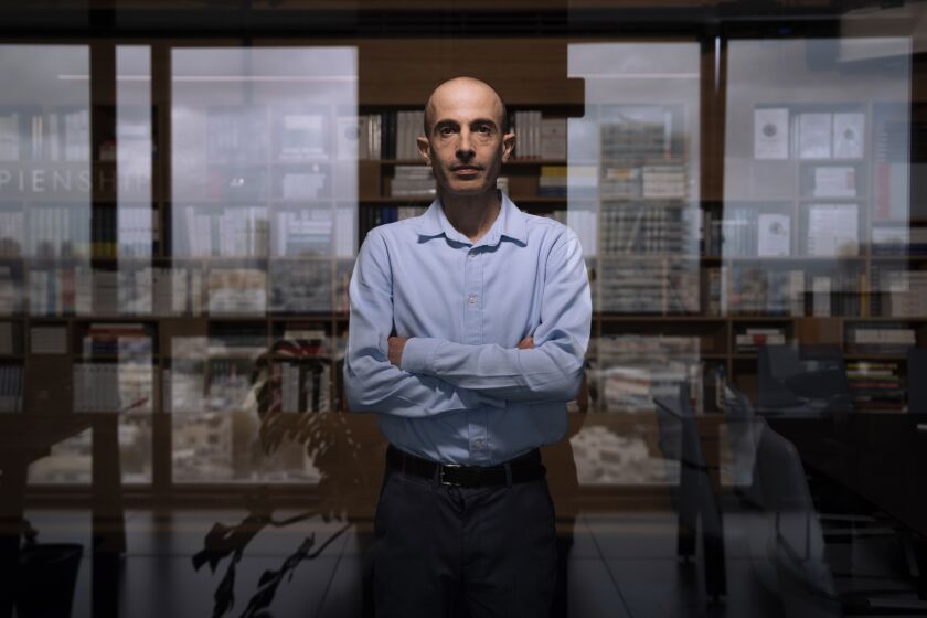 Israeli historian, philosopher and best-selling author Yuval Noah Harari poses for a photo at his office in Tel Aviv, Israel, Thursday, March 30, 2023. Harari says Prime Minister Benjamin Netanyahu may go down in history as the man who destroyed Israel. Harari, who has been vocal about his opposition to a proposed judicial overhaul by Netanyahu's right-wing government, says the long-serving prime minister has divided the country to preserve his political longevity. (AP Photo/Oded Balilty)