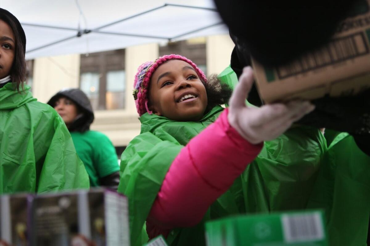 The Girl Scouts should stop trying to portray their Mango Creme cookies as a health food, say leaders of the Center for Science in the Public Interest. Above, Girl Scout cookies were selling briskly at stands set up in Midtown Manhattan on Friday as residents stocked up on vital supplies in anticipation of a punishing winter storm.