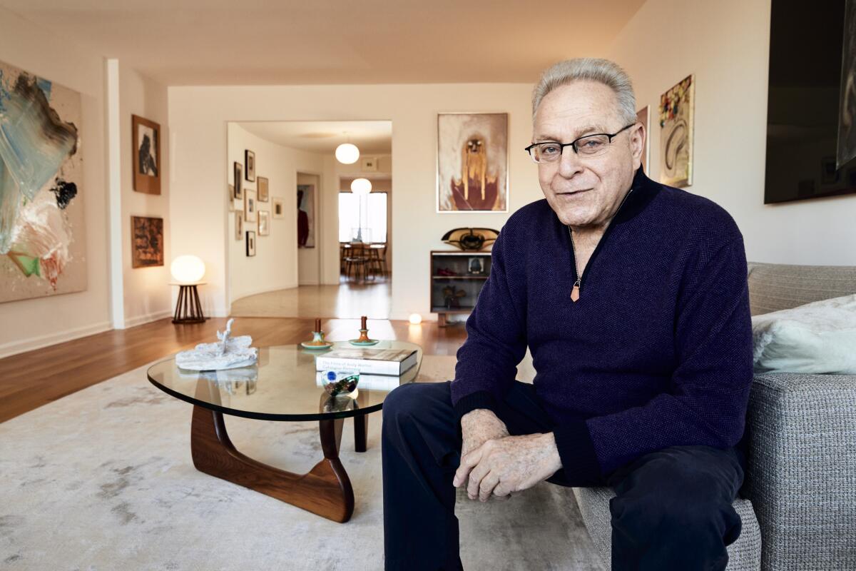 Joel Wachs sits for a portrait in his apartment.
