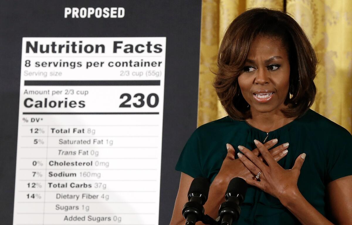 First lady Michelle Obama announces proposed changes to food labels during an event in the East Room of the White House.