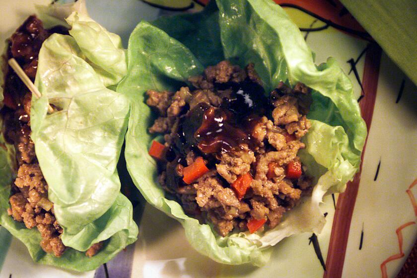 Quick.Turkey -- Minced turkey in lettuce cups. Plate and Napkin are from Crate & Barrel.