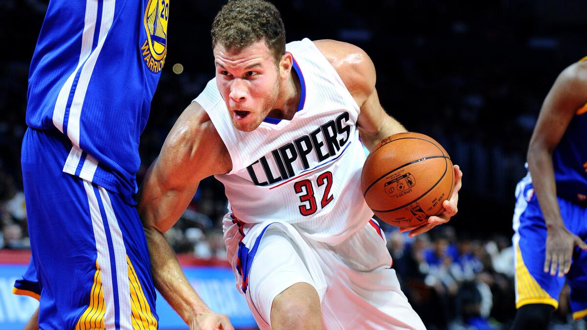 Clippers forward Blake Griffin drives against the Warriors during their preseason game on Oct. 20 at Staples Center.