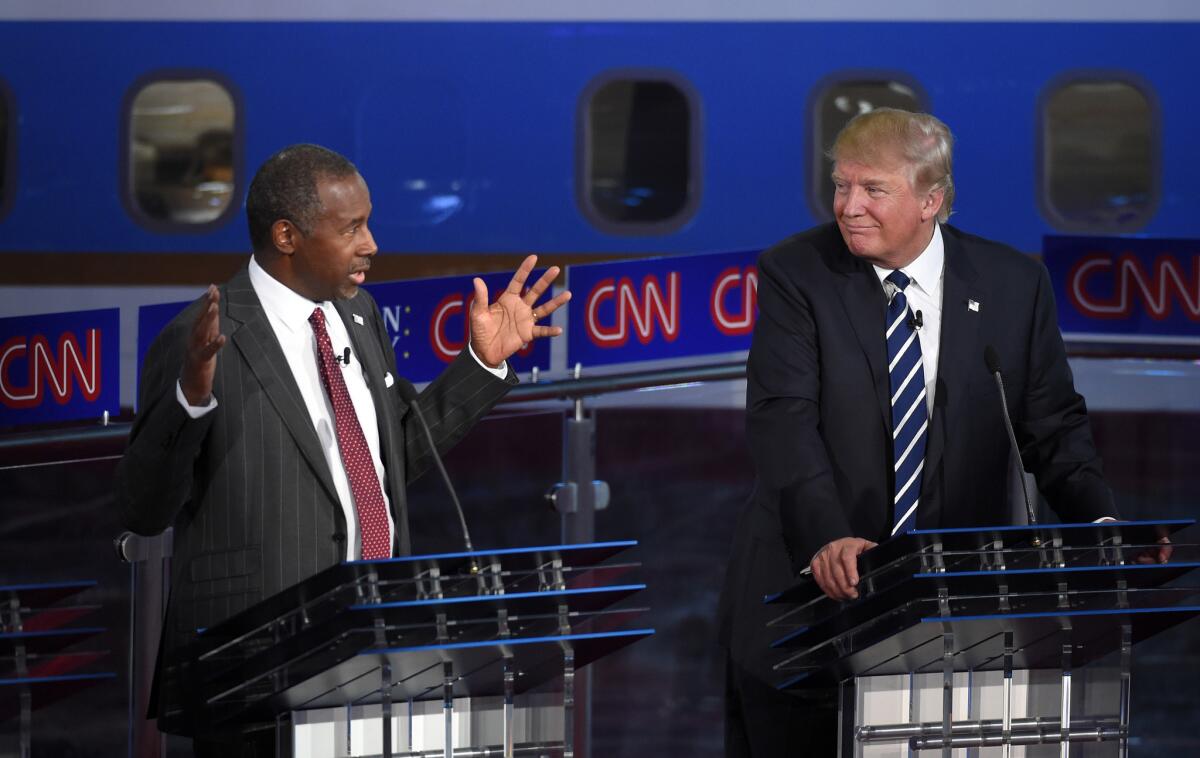 Presidential hopefuls and political outsiders Ben Carson and Donald Trump participate in the Republican Presidential Debate at the Ronald Reagan Presidential Library in Simi Valley on Weds. evening.
