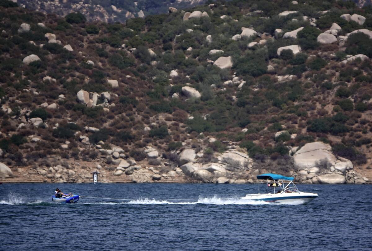 Boaters take to the water during a record-setting heat wave at San Vicente Reservoir 