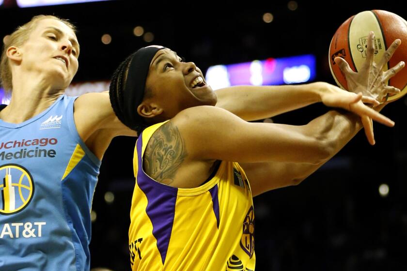 Sparks guard Alexis Jones is fouled on a layup by Sky guard Allie Quigley during the second half Sunday.