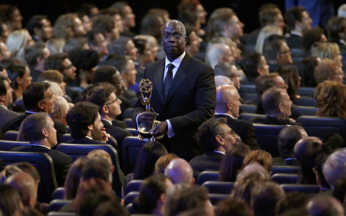 During a skit, "Brooklyn Nine-Nine's" Andre Braugher carries the venue's "bathroom key," attached to an Emmy.