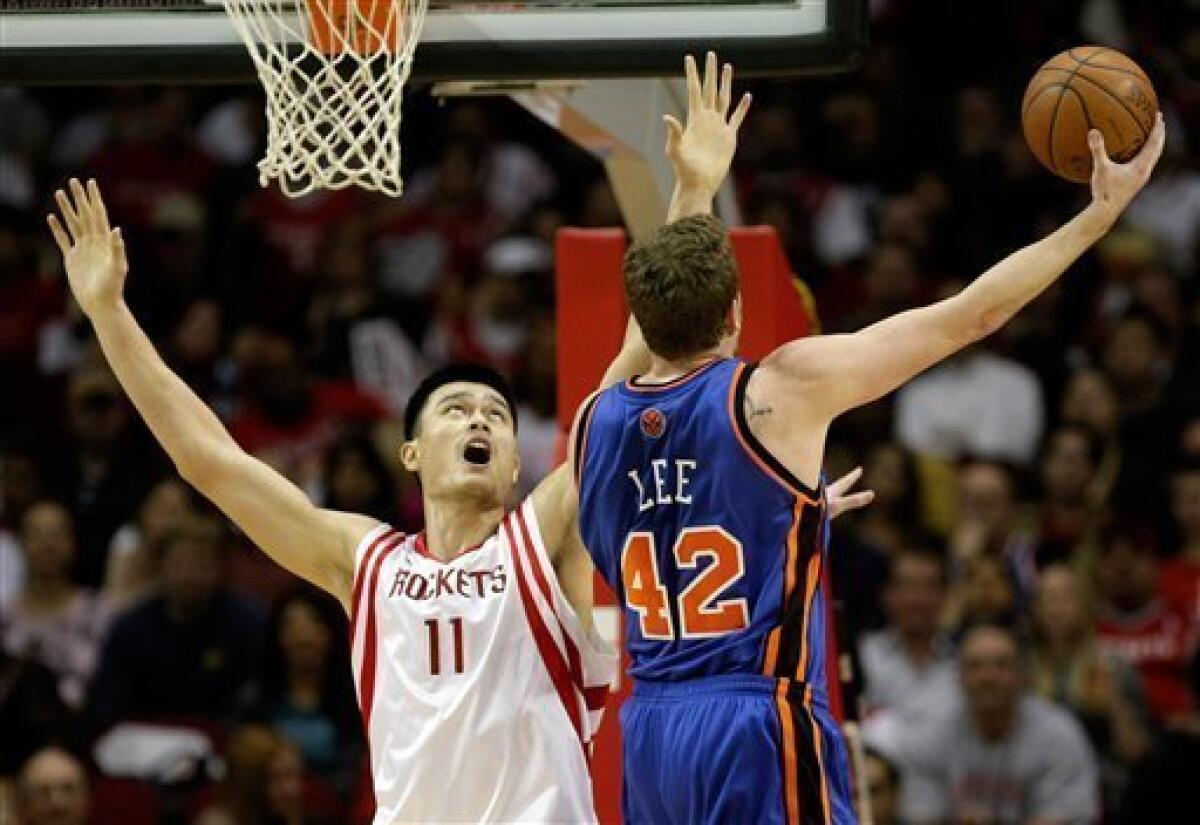 nate robinson dunking over yao ming