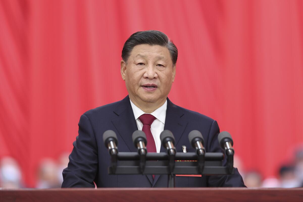 Xi Jinping gives a speech at a podium