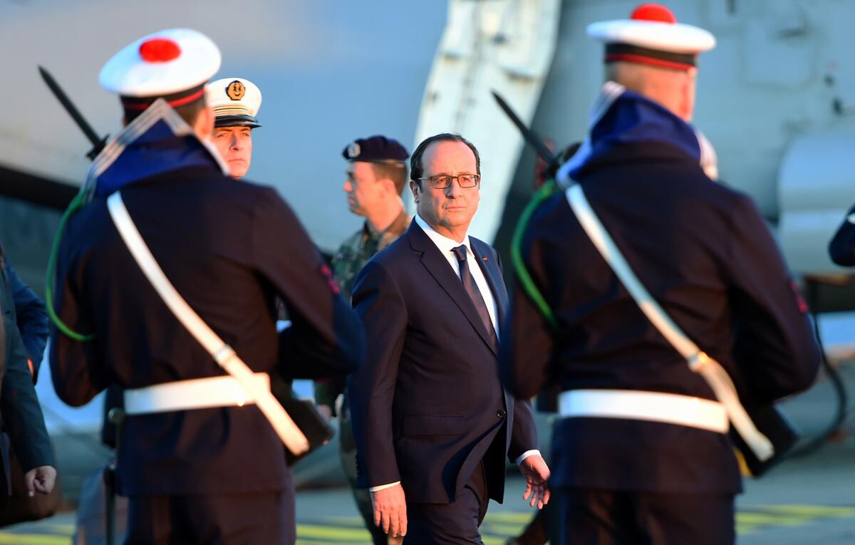 French President Francois Hollande visits the French aircraft carrier Charles de Gaulle on Wednesday. He announced that the carrier would be deployed to the Middle East to back the U.S.-led campaign against the Islamic State militant group.