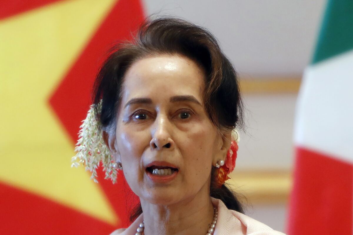 FILE - Then Myanmar's leader Aung San Suu Kyi speaks during a joint press conference with Vietnam's Prime Minister Nguyen Xuan Phuc after their meeting at the Presidential Palace in Naypyitaw, Myanmar on Dec. 17, 2019. The four-year prison sentence given to ousted Myanmar leader Suu Kyi on Monday, Dec. 6, 2021 on charges of incitement and failing to observe pandemic restrictions is one small shot in a legal offensive intended to deal her and her National League for Democracy party a crippling political blow. (AP Photo, File)