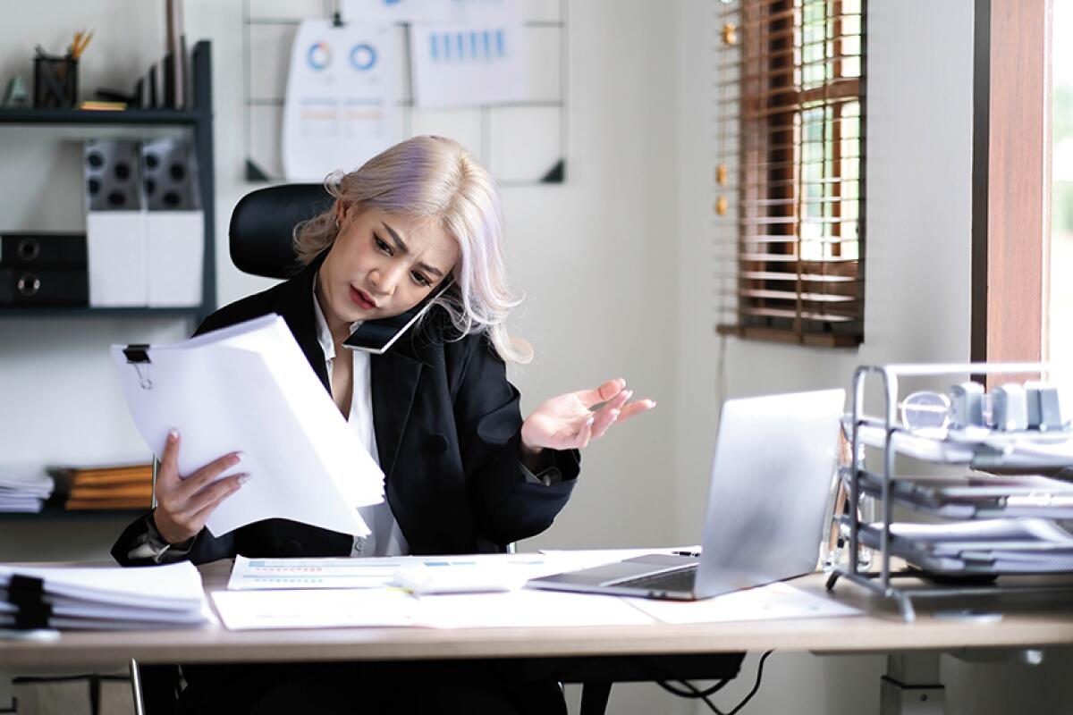 A woman works at a desk