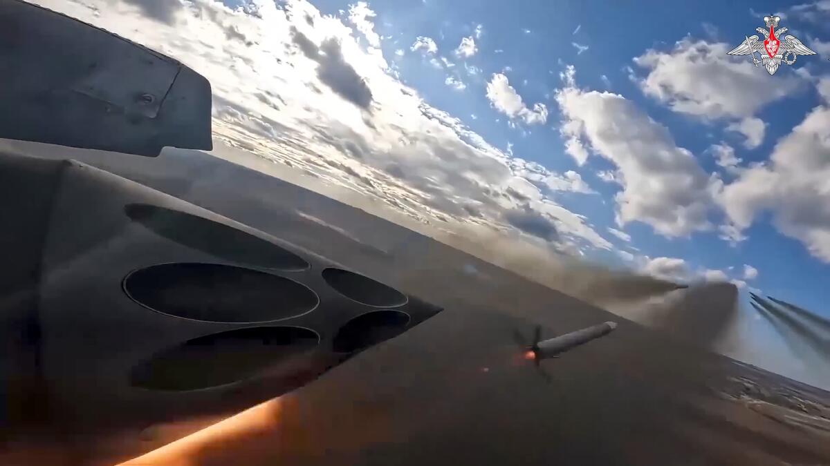 A jet fighter fires a rocket
