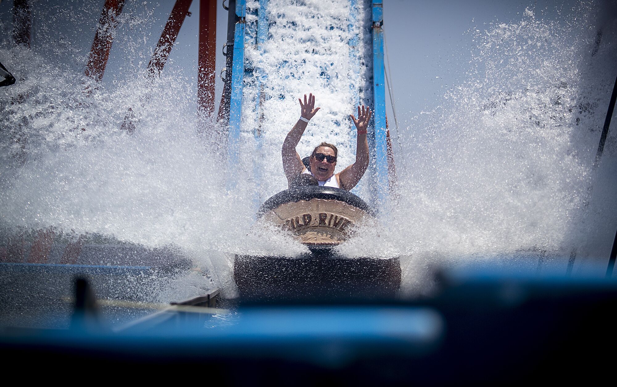 A woman rides the Wild River ride at the Orange County Fair.